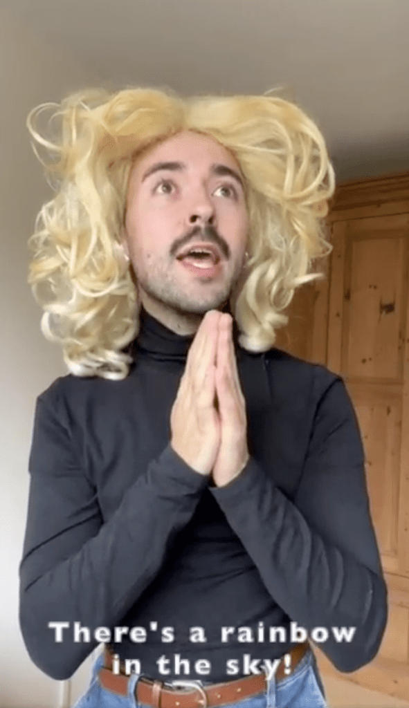 Brit queer actor Rob Madge gently ribs the solemnity of the  (22 hour long) line to see the  Queen Lying In State