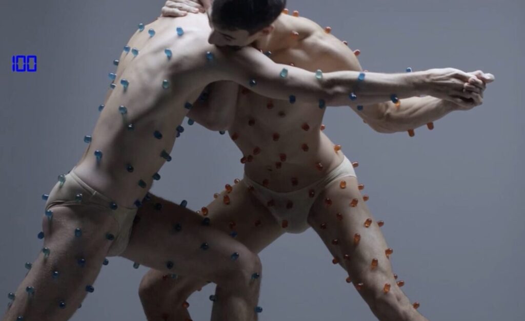 SWEATMEAT by  Bart Hess : two Bodies are locked in a fight choreography with a sweet prize